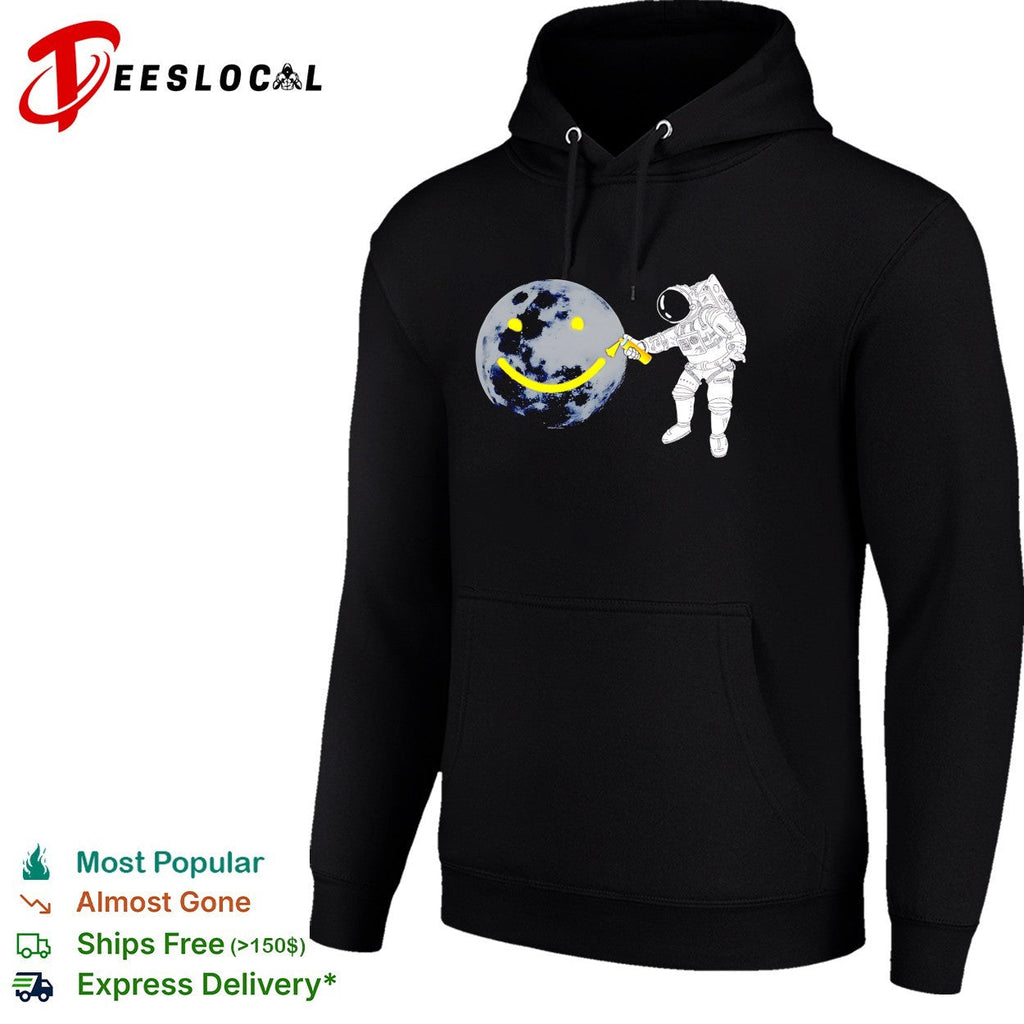 Astronaut spray painting smiley face on moon shirt Unisex