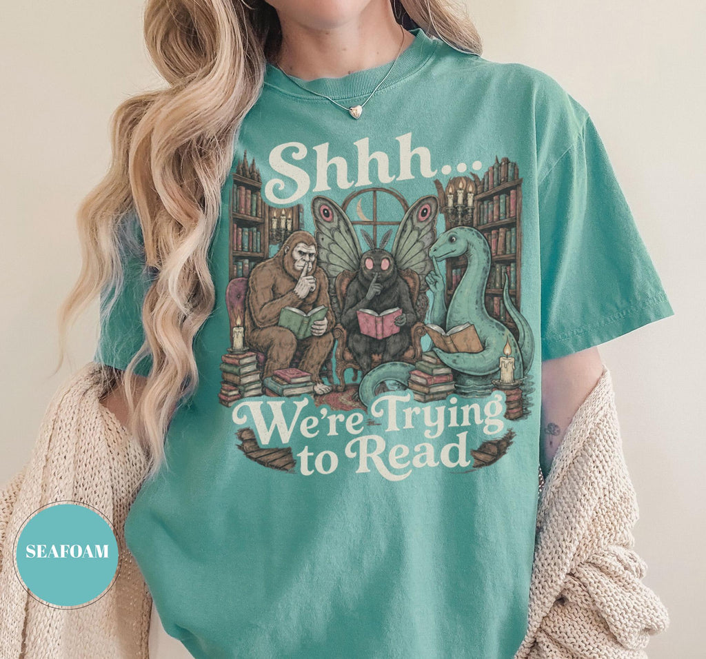 Shhh We'Re Trying Read Cryptid Bigfoot Mothman Nessie Bookish Tee Book Lover Dark Academia Reading Librarian